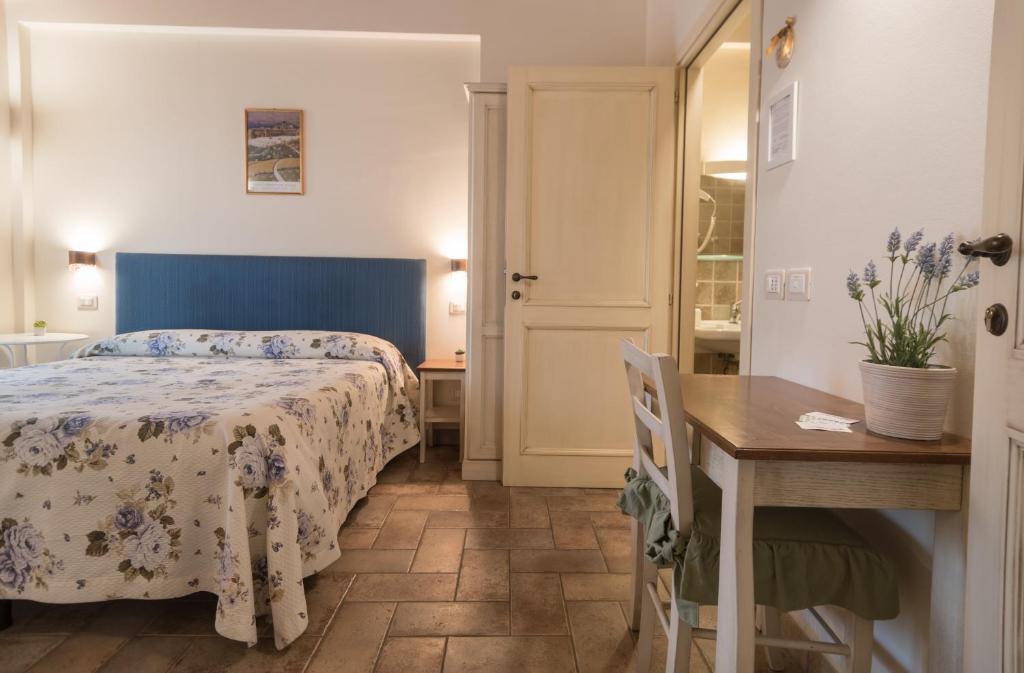 Postel nebo postele na pokoji v ubytování Rosa di Assisi