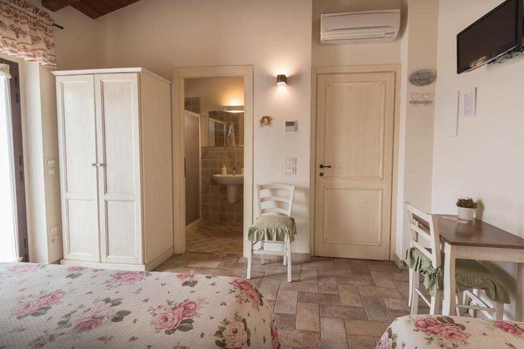 Postel nebo postele na pokoji v ubytování Rosa di Assisi