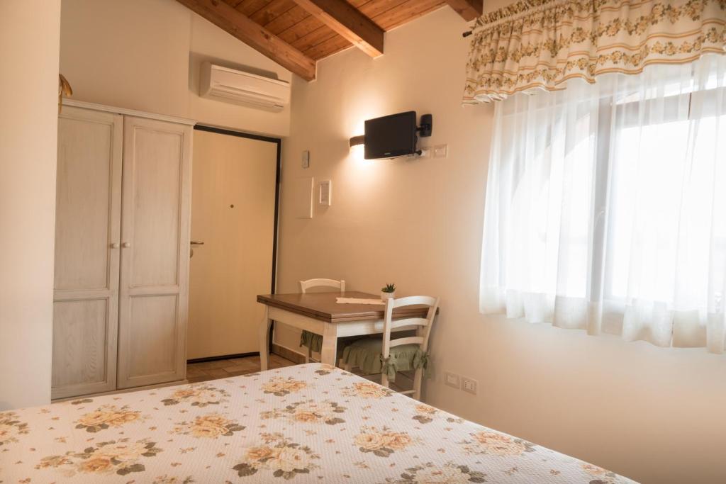Postel nebo postele na pokoji v ubytování Rosa di Assisi