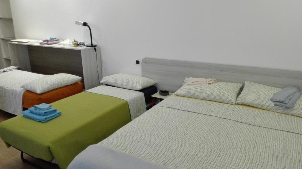 En eller flere senge i et værelse på Ca'cita Guest House Torino