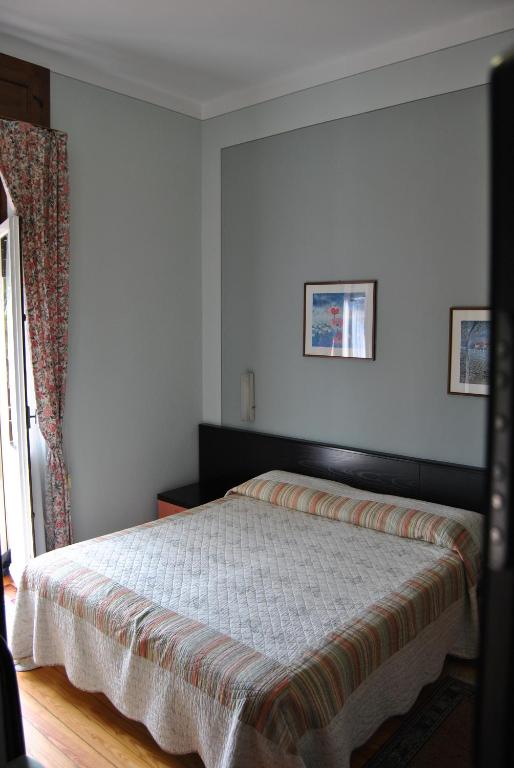 Postel nebo postele na pokoji v ubytování Hotel Villa Mon Toc