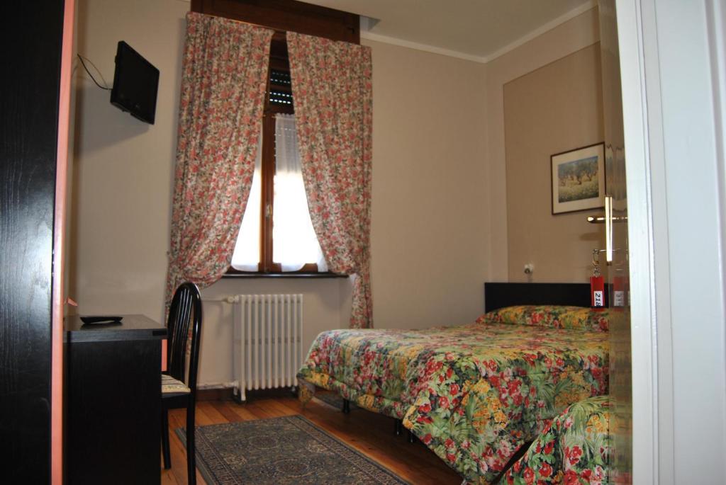 Postel nebo postele na pokoji v ubytování Hotel Villa Mon Toc