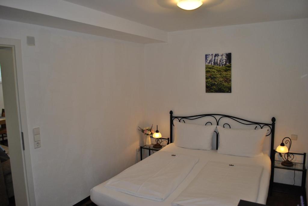 Postel nebo postele na pokoji v ubytování Hotel & Chalets Herrihof