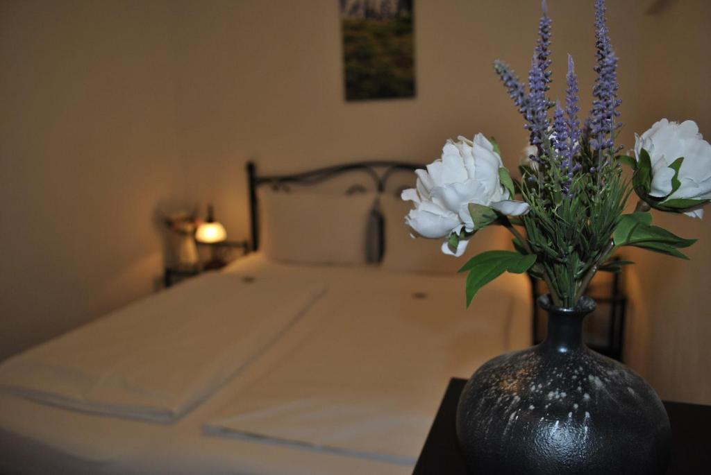 Postel nebo postele na pokoji v ubytování Hotel & Chalets Herrihof