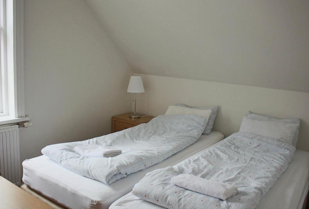 Postel nebo postele na pokoji v ubytování Mánagisting Guesthouse