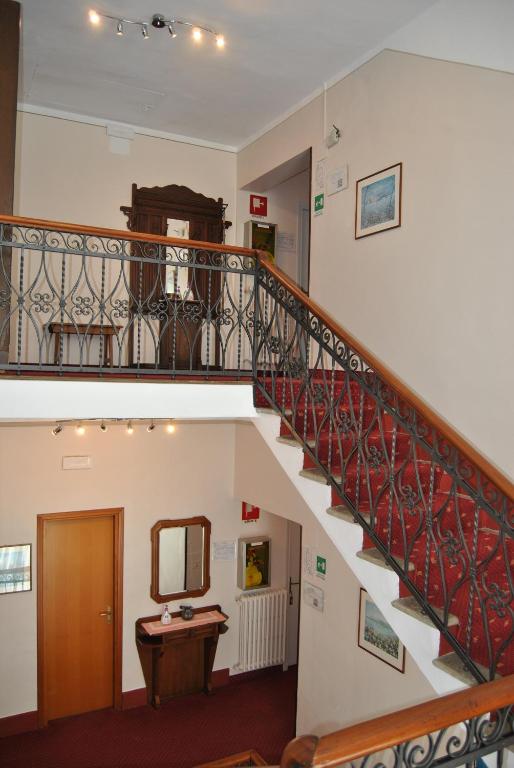 a staircase leading up to a stairwell with a balcony at Hotel Villa Mon Toc in Stresa