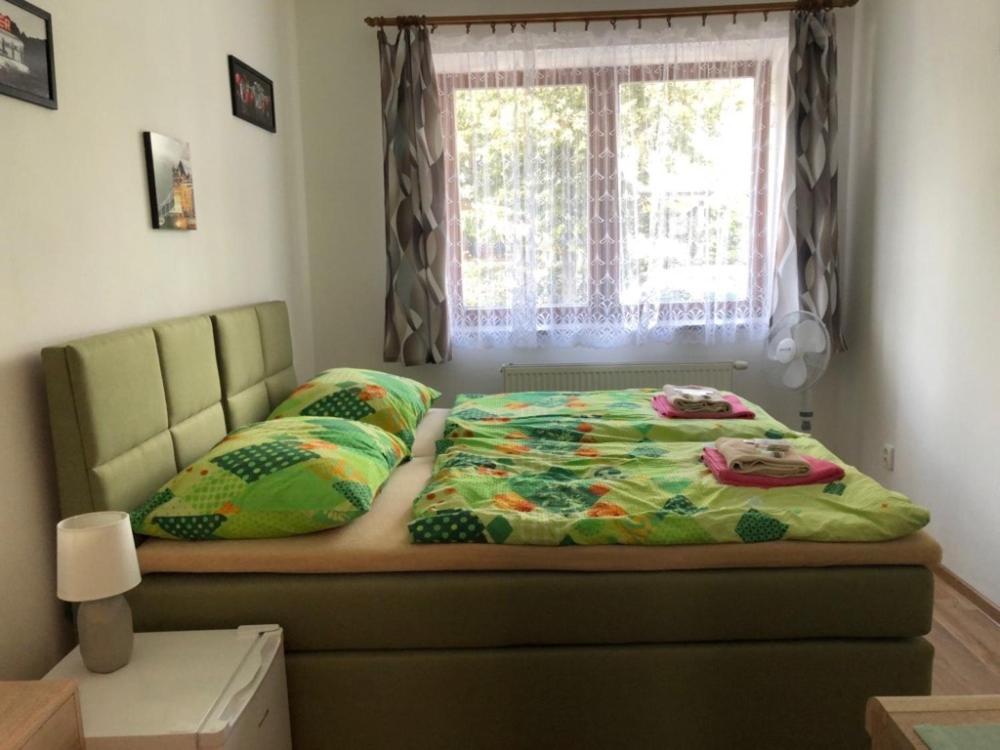 Postel nebo postele na pokoji v ubytování Penzion Na Hrazi