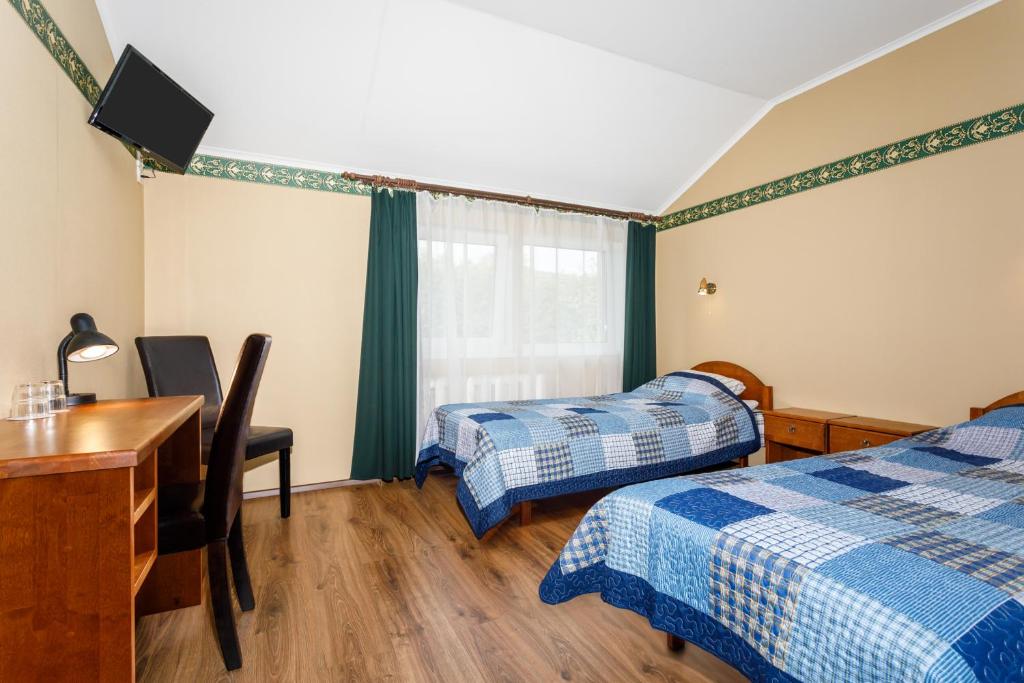 Postel nebo postele na pokoji v ubytování Kapten Krantz Guesthouse