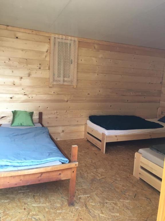 Postel nebo postele na pokoji v ubytování Ranč Vápenka