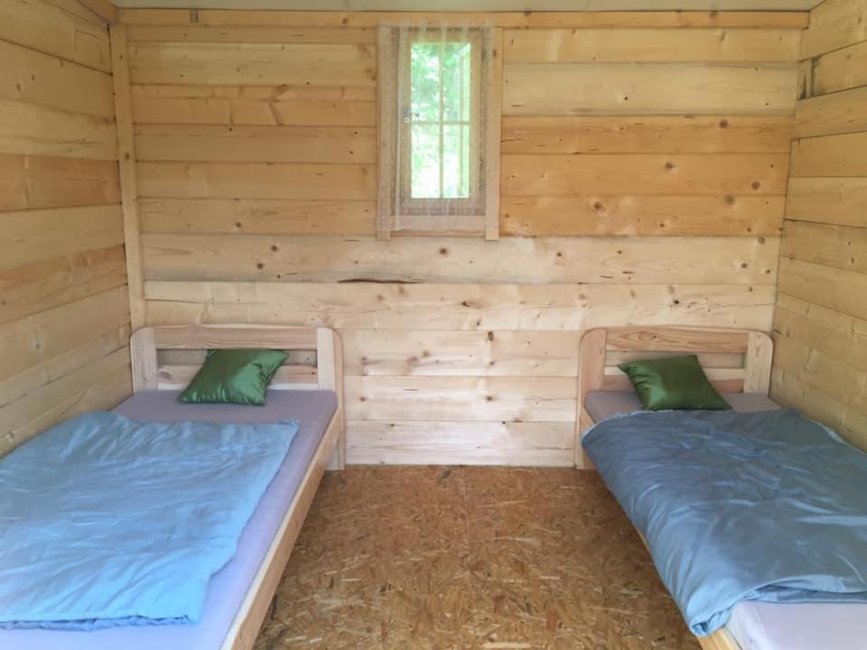 Postel nebo postele na pokoji v ubytování Ranč Vápenka