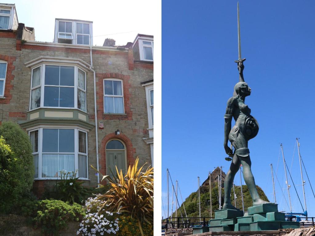 a statue of a woman in front of a building at Lighthouse View in Ilfracombe