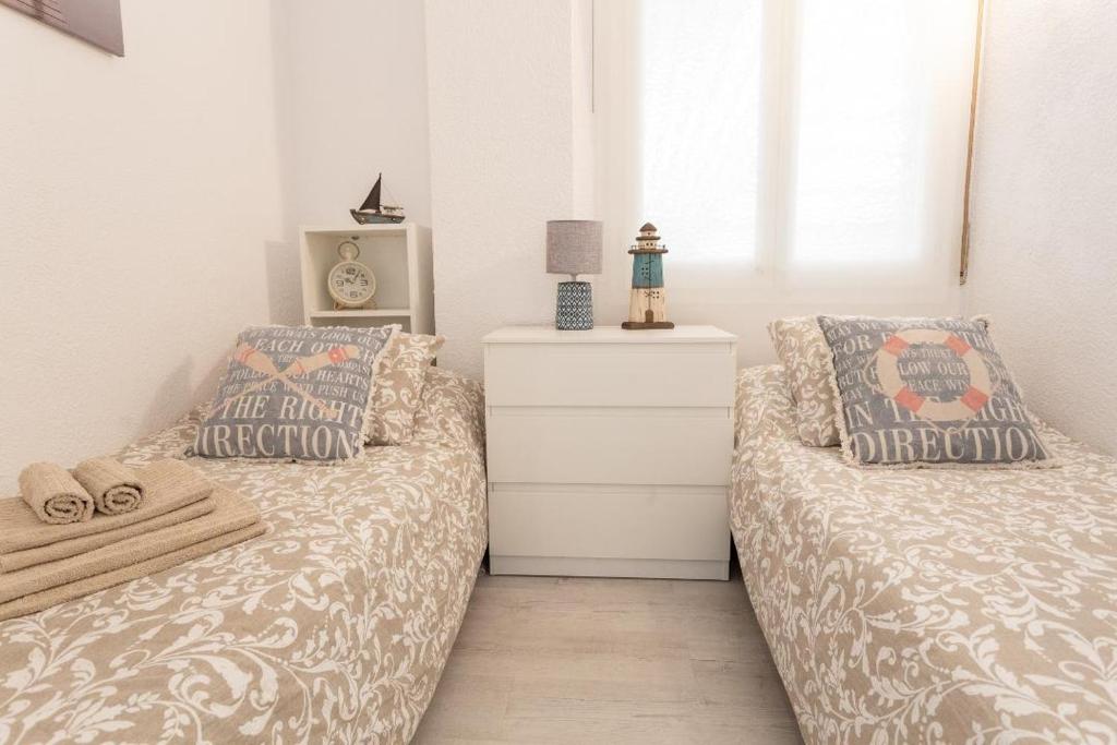Posteľ alebo postele v izbe v ubytovaní Apartamentos Stil Mar Anna - Stil Mar Jardin Anna