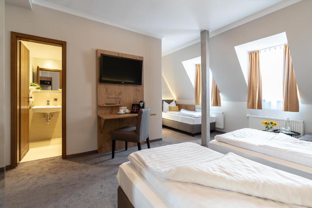 Postel nebo postele na pokoji v ubytování Hotel & Restaurant Ritter Jörg