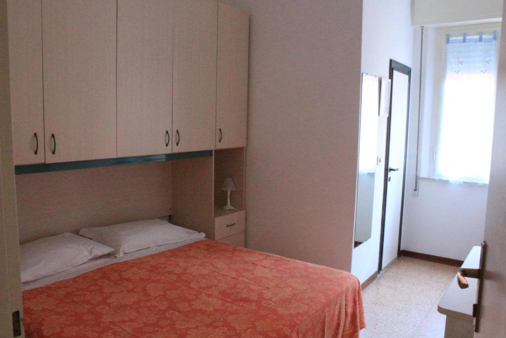 Postel nebo postele na pokoji v ubytování Pensione Fiorella Rimini