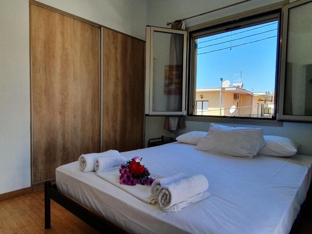 Postel nebo postele na pokoji v ubytování Tasos Rooms