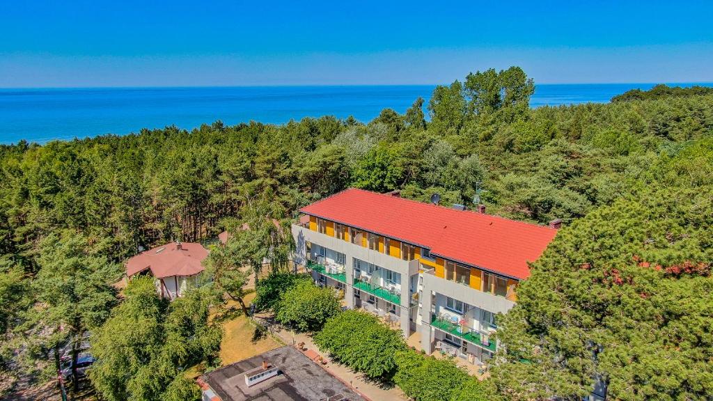 an overhead view of a building with a red roof at Ameba Resort in Mielno