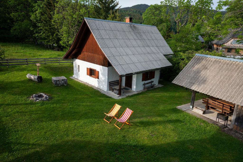 an aerial view of a house with two chairs in the yard at Holiday Home Srednja vas in Srednja Vas v Bohinju