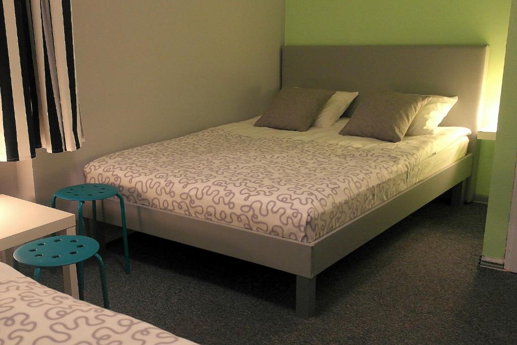Postel nebo postele na pokoji v ubytování Olive Hostel