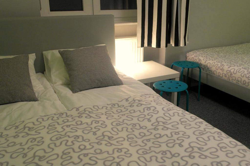 Postel nebo postele na pokoji v ubytování Olive Hostel