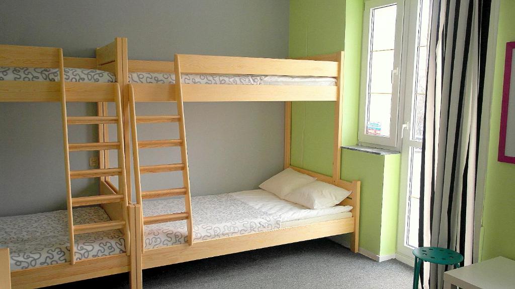Postel nebo postele na pokoji v ubytování Olive Hostel