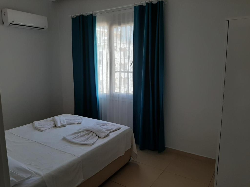 Postel nebo postele na pokoji v ubytování Antiocha Residence
