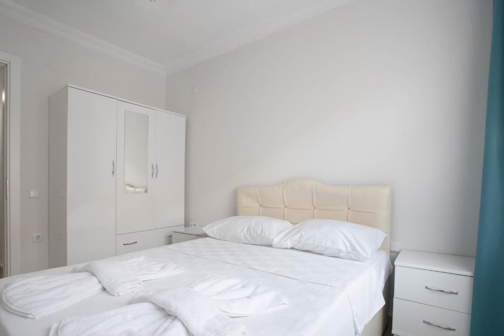 Postel nebo postele na pokoji v ubytování Antiocha Residence