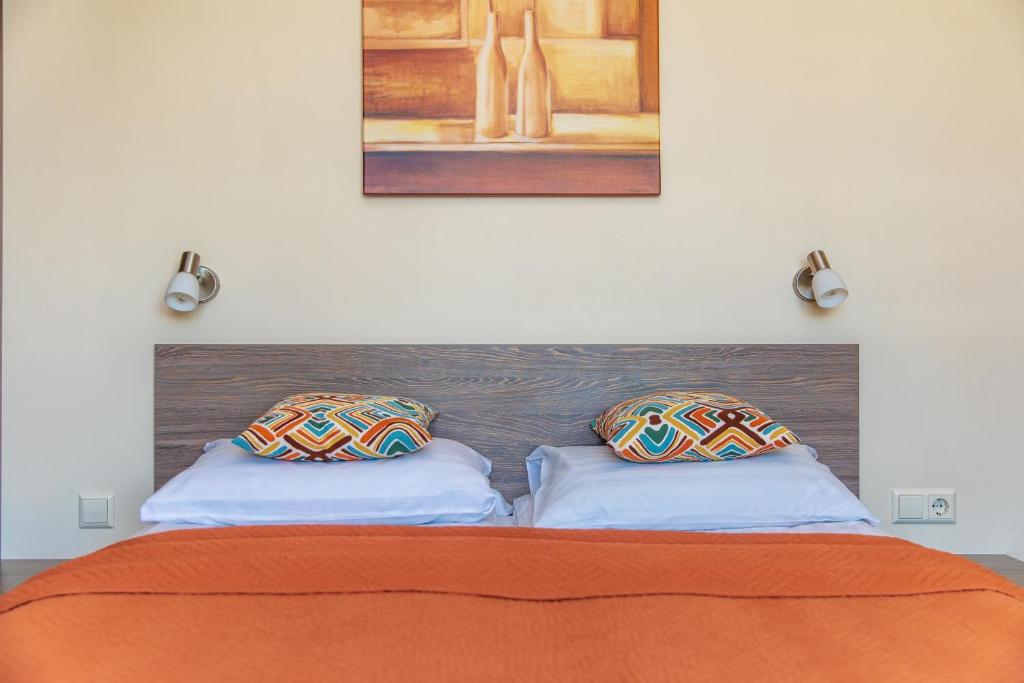 Un pat sau paturi într-o cameră la Palangos Vila