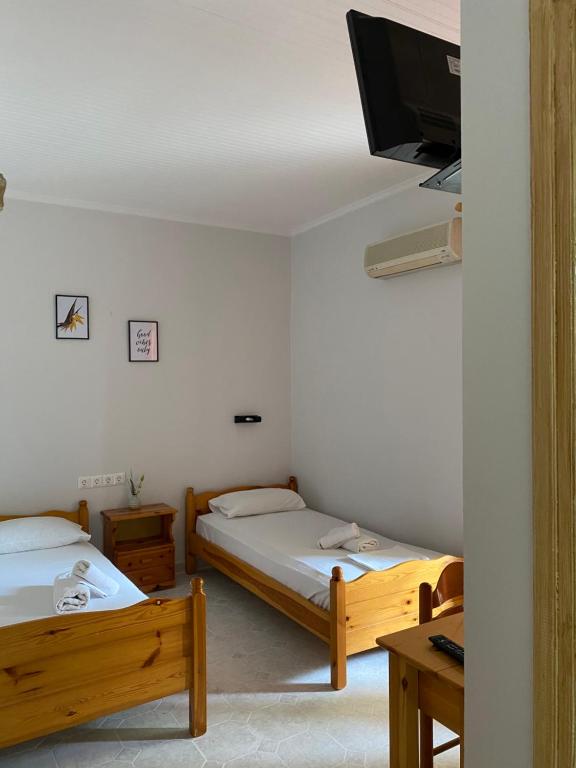 Postel nebo postele na pokoji v ubytování Faros Studios