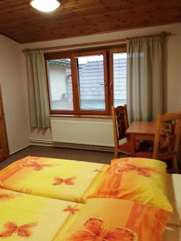 Postel nebo postele na pokoji v ubytování Penzion Jendrál