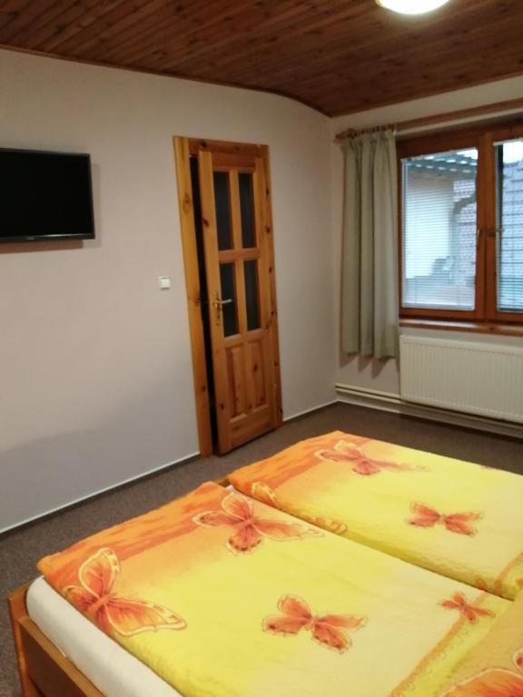 Postel nebo postele na pokoji v ubytování Penzion Jendrál