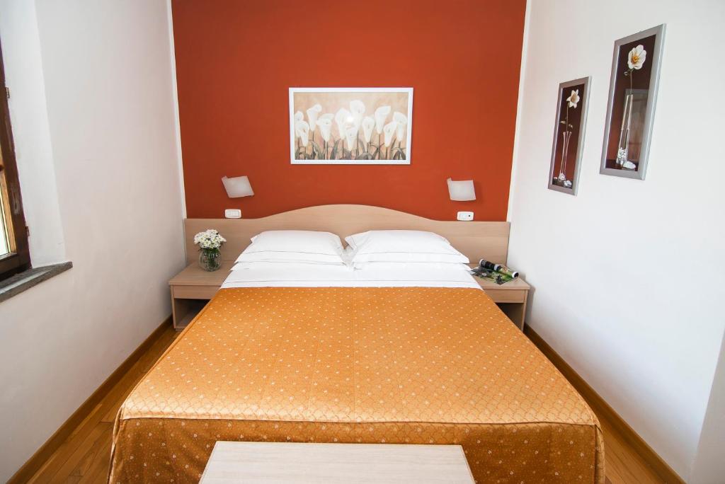 Postel nebo postele na pokoji v ubytování Hotel La Colonna