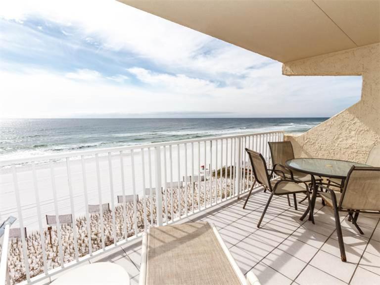 a balcony with a table and chairs and the ocean at Island Echos 4th-5th Floor Condos in Fort Walton Beach