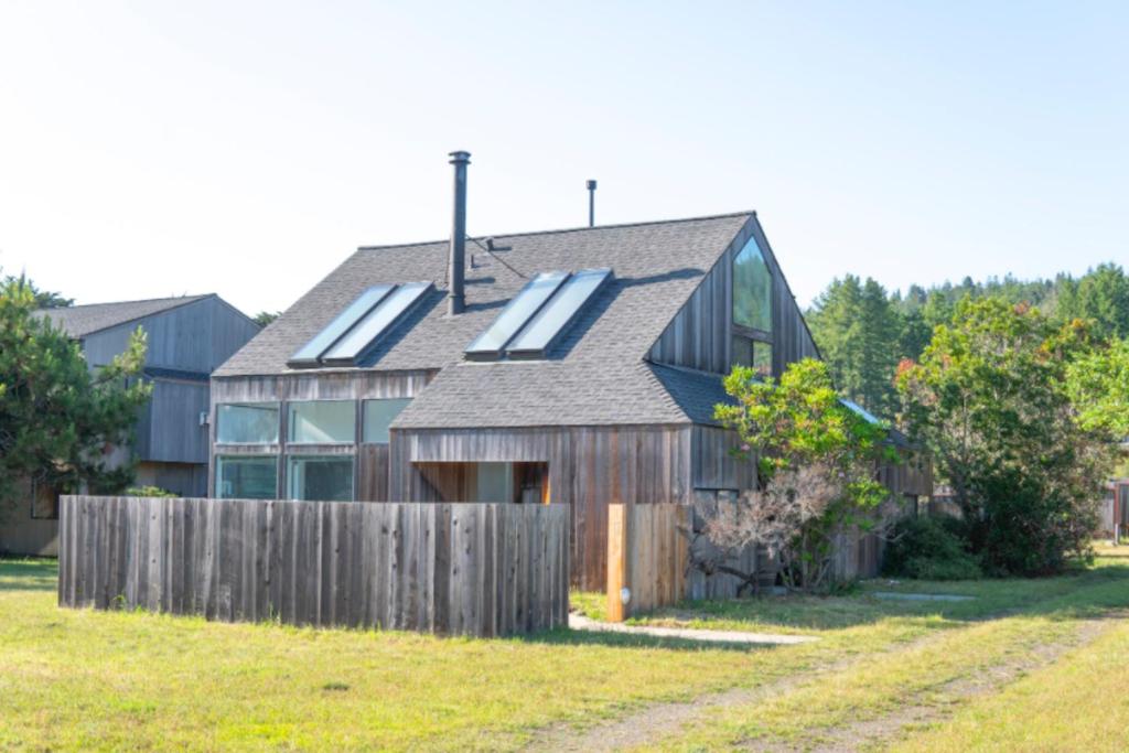 a house with solar panels on the roof at One Eyed Jack's Retreat in Sea Ranch