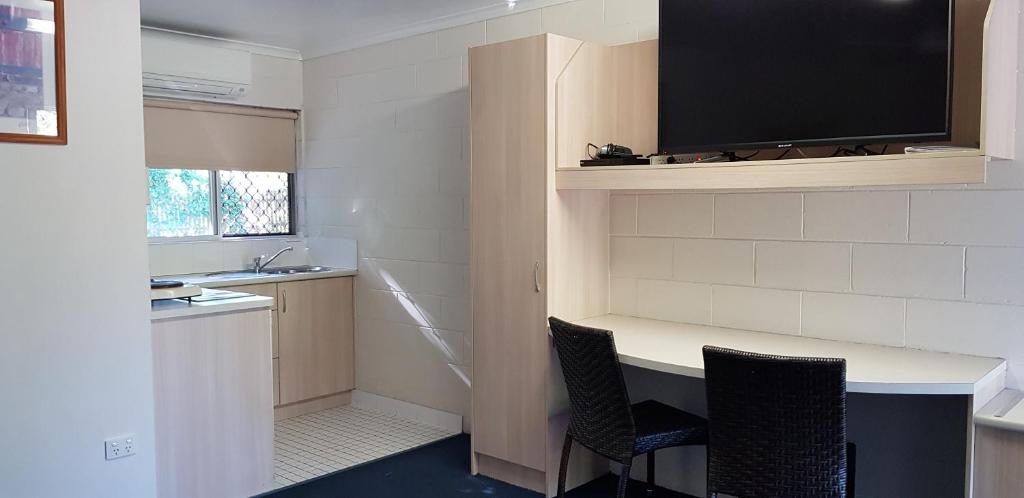 Kuchyň nebo kuchyňský kout v ubytování Mango Tree Motel