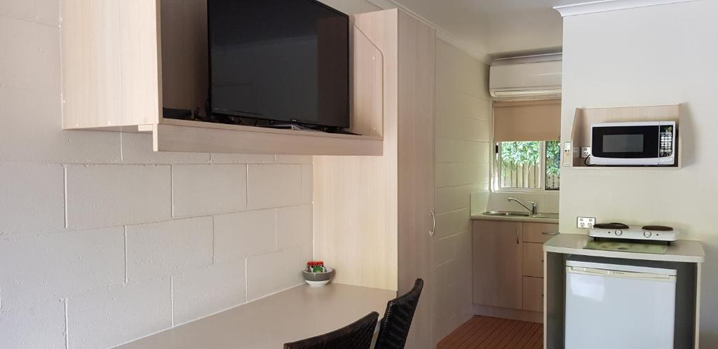 Kuchyň nebo kuchyňský kout v ubytování Mango Tree Motel