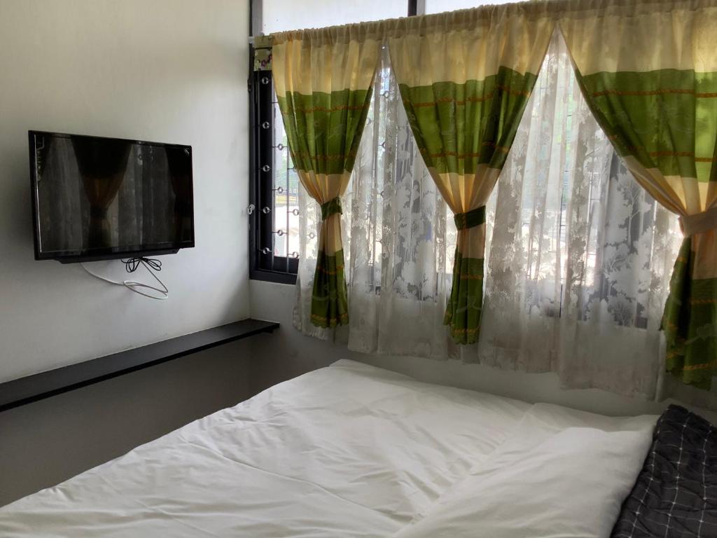Postel nebo postele na pokoji v ubytování Room@Nimman