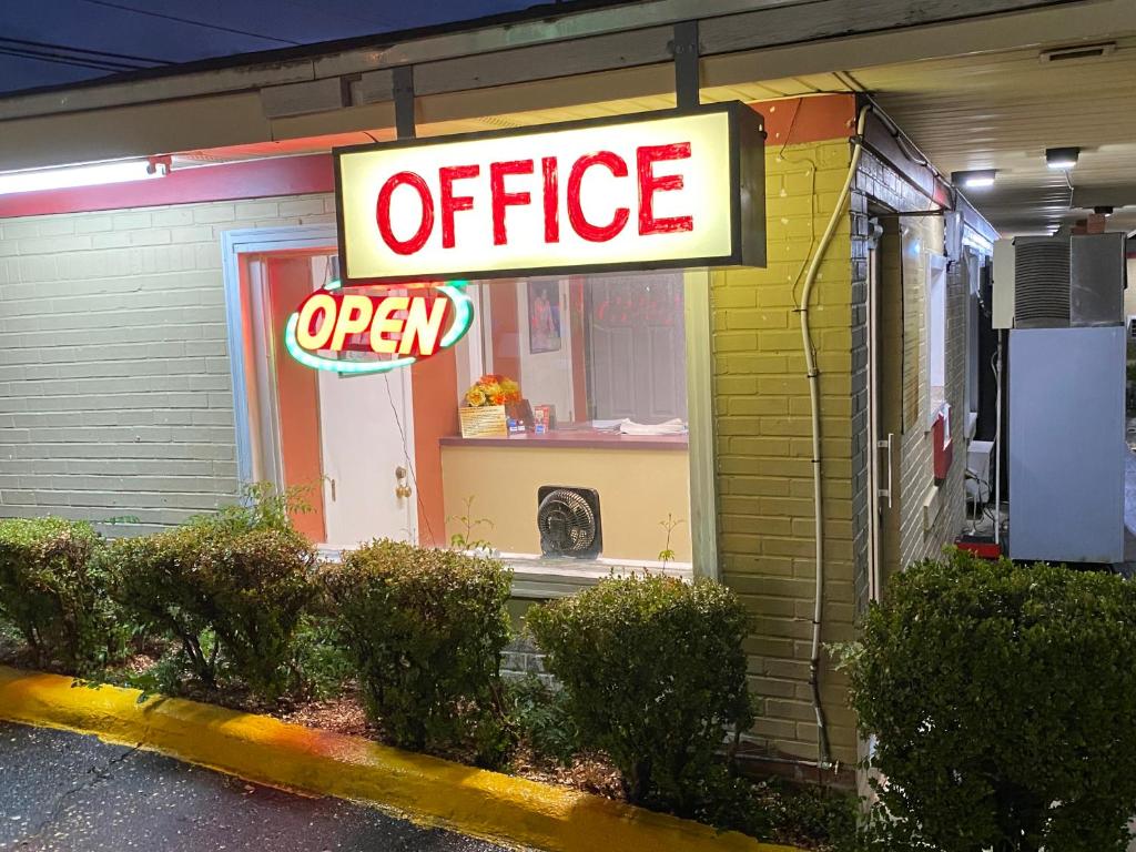 an office open sign in front of a store at Budget Inn in Dothan