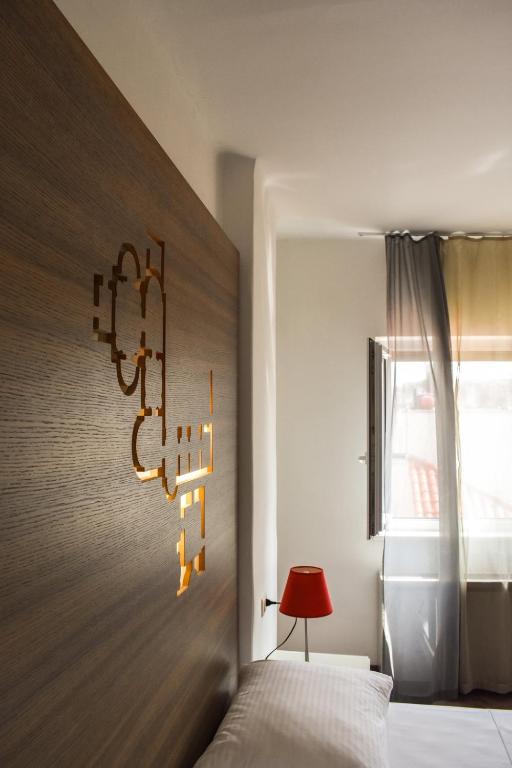 Posteľ alebo postele v izbe v ubytovaní Slavija Culture Heritage Hotel