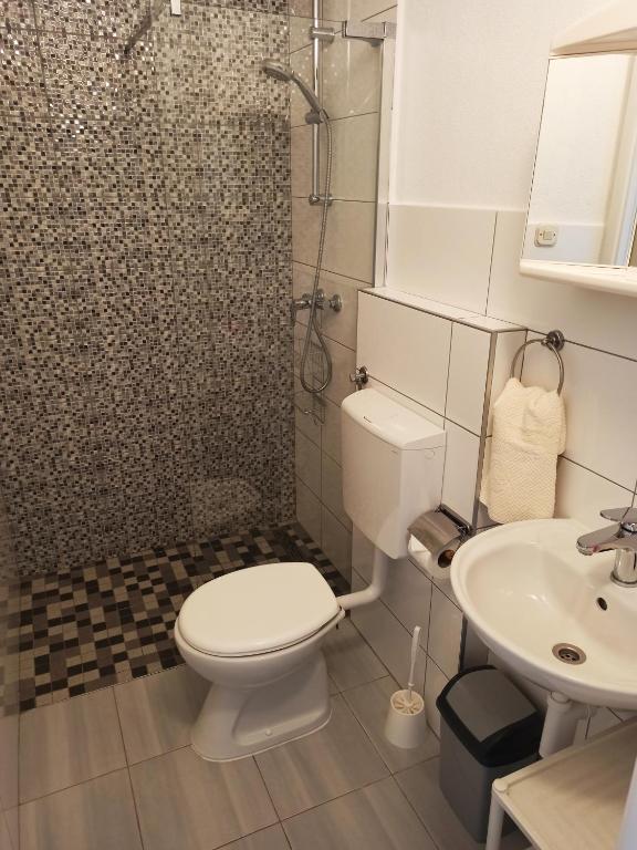 Łazienka w obiekcie Apartments Sonija