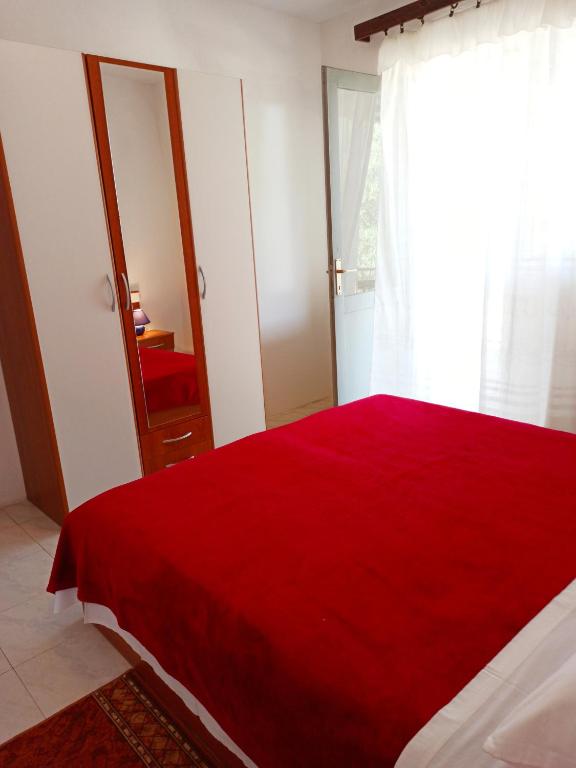 Łóżko lub łóżka w pokoju w obiekcie Apartments Sonija