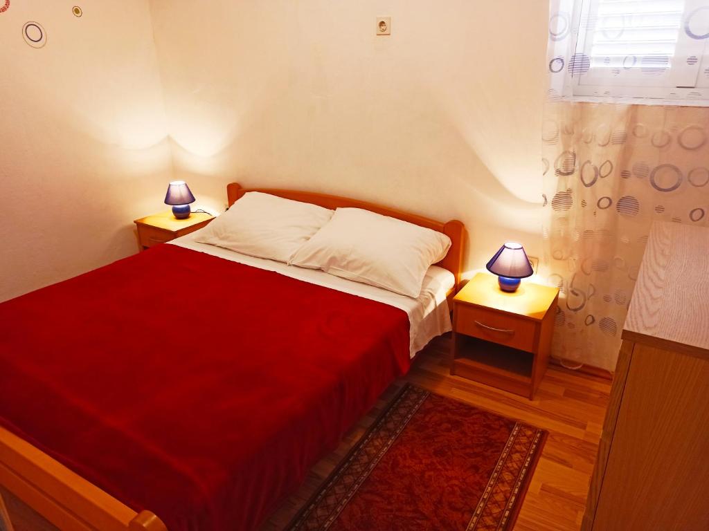 Łóżko lub łóżka w pokoju w obiekcie Apartments Sonija
