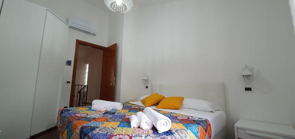 Postel nebo postele na pokoji v ubytování B&B Capo Le Vigne