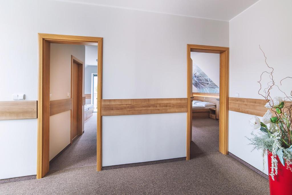 A bed or beds in a room at Apartmány Zaria