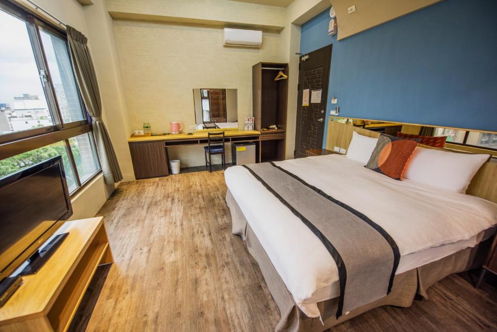 Postel nebo postele na pokoji v ubytování Ruo Shui Hotspring Hotel