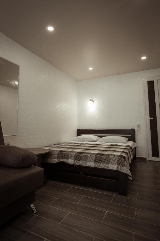 Postel nebo postele na pokoji v ubytování REEF Hotel