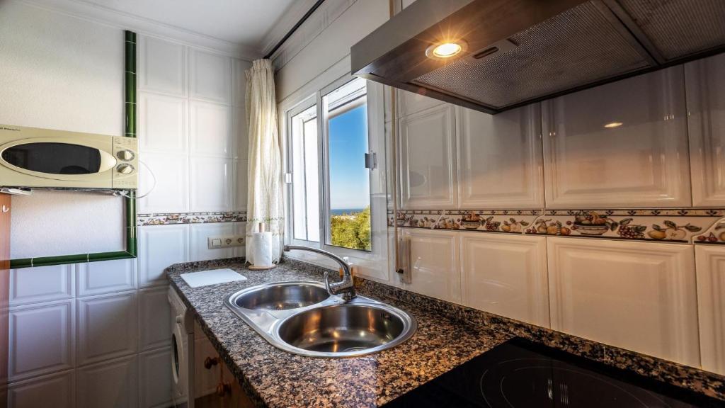Kuchyň nebo kuchyňský kout v ubytování Apartamento Luz C