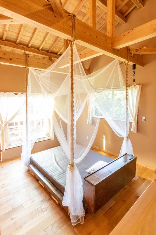 Postel nebo postele na pokoji v ubytování YOISAMA Sunset Beach House