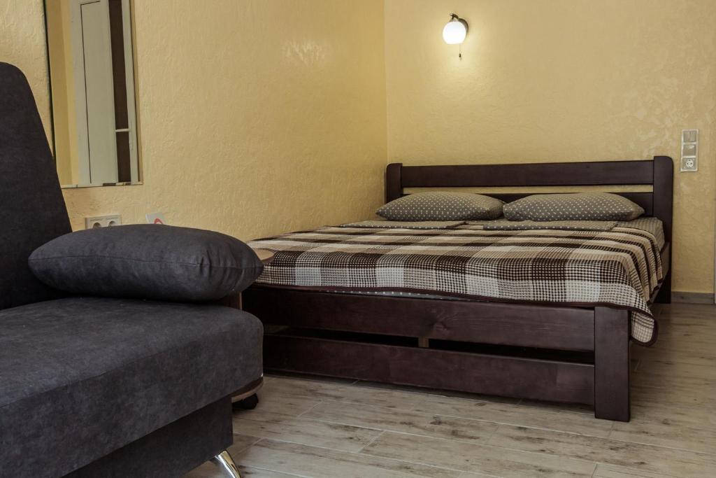 Postel nebo postele na pokoji v ubytování REEF Hotel