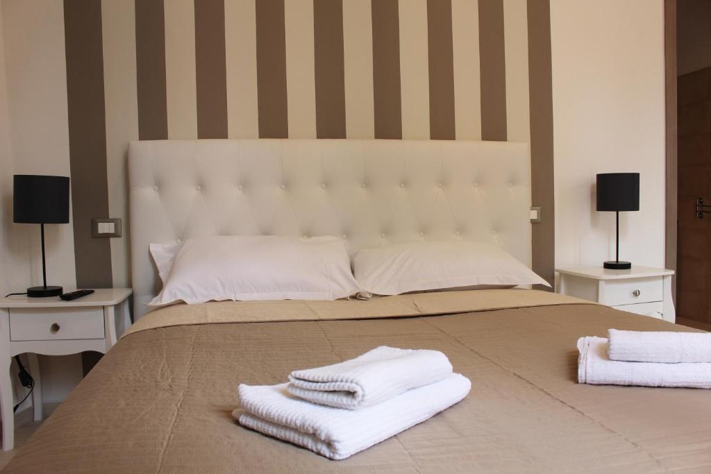 Postel nebo postele na pokoji v ubytování Maestrale Charme Rooms