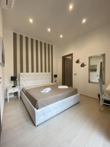 Postel nebo postele na pokoji v ubytování Maestrale Charme Rooms
